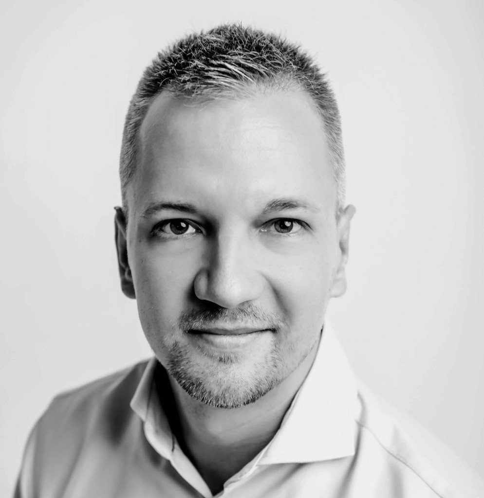 Black-and-white portrait of Viktor, founder of Vibe Coder's Life